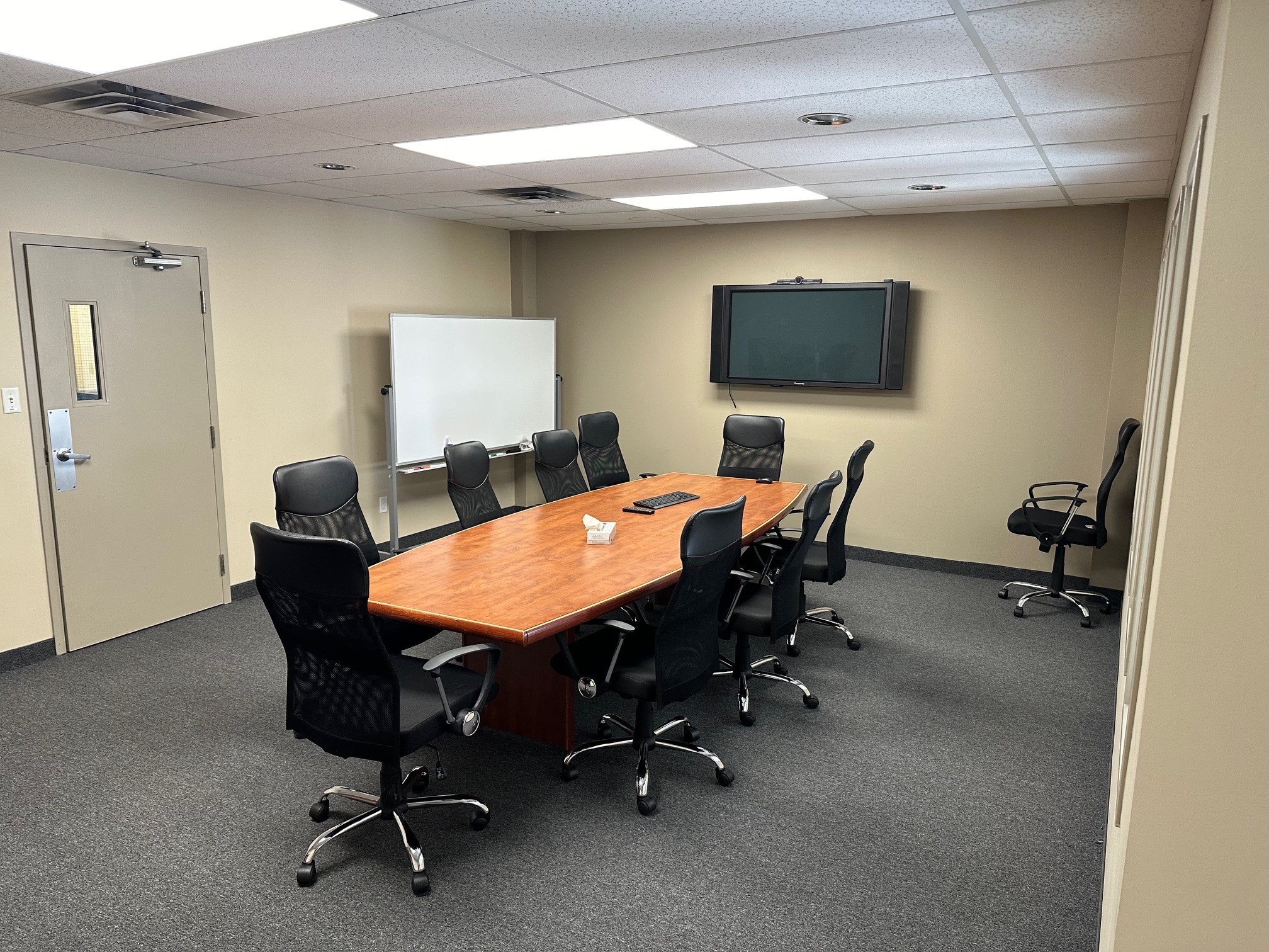 Professional boardroom meeting space at Flite Line Services FBO YKF Kitchener-Waterloo